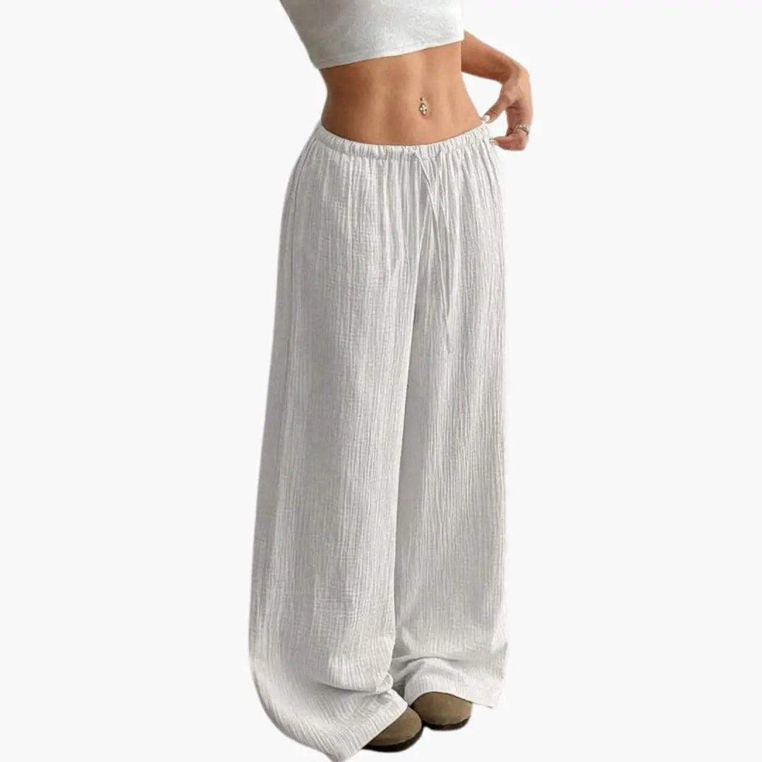 Women’s wide-leg summer pants with elastic waistband, pull-on full-length trousers in light gray crinkled fabric.