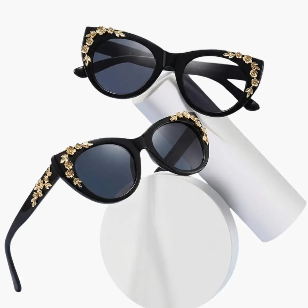 Two Wilfred Smith women's cat-eye sunglasses, black frames with gold floral accents, UV400 lenses