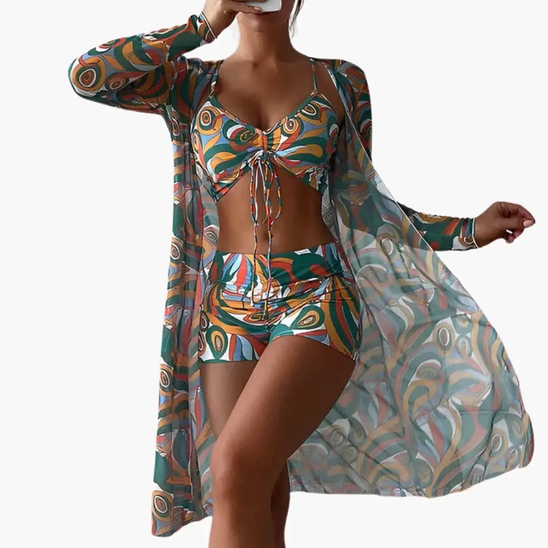 Women's swirl-print one-piece swimsuit with front overlay panel; vibrant teal, orange, and green pattern.
