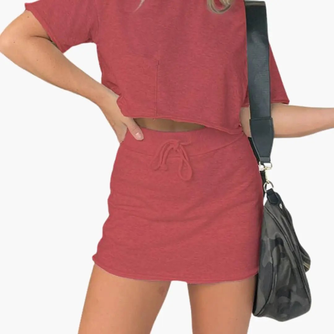 Women's two-piece outfit set with red crop top and drawstring waist skirt by Wilfred Smith