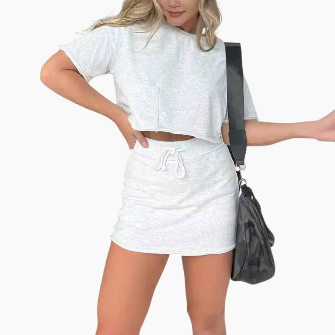 Women's two-piece outfit set with cropped top and drawstring waist mini skirt in heather gray.