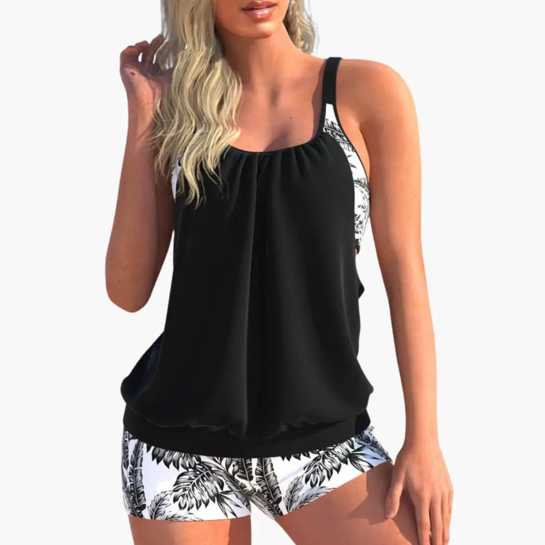 Women’s Tankini Set by Wilfred Smith: black tankini top with palm-leaf side panels and matching palm-print shorts.