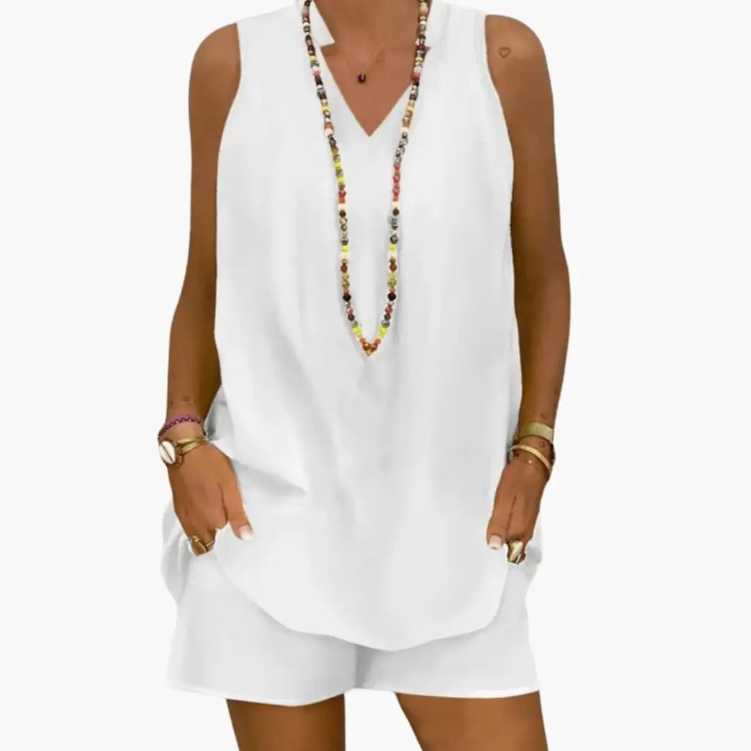 Women's two-piece white tunic and shorts set by Wilfred Smith with sleeveless longline V-neck top