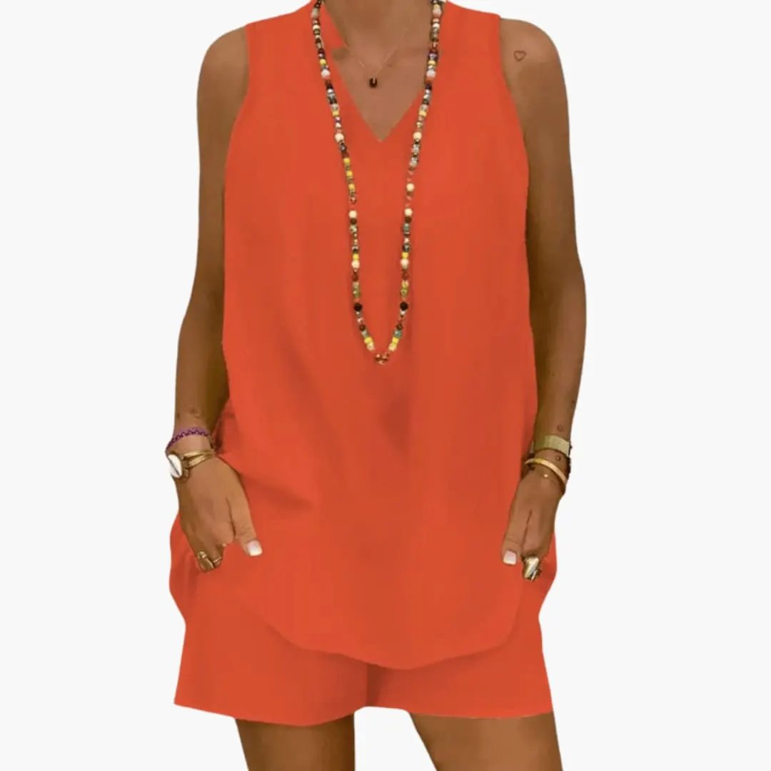 Women's tunic and shorts set in bright orange, sleeveless longline top with matching shorts.