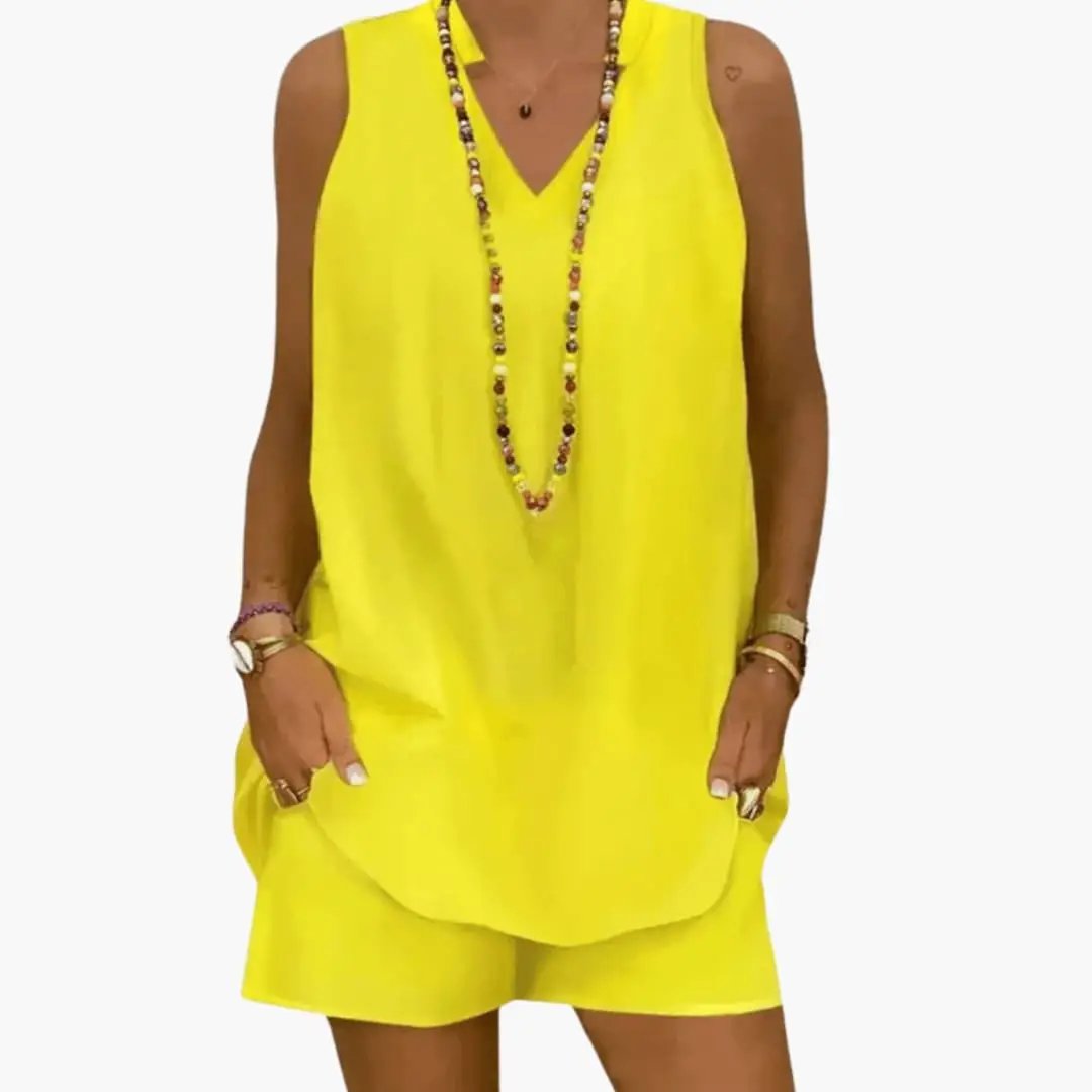 Wilfred Smith women's tunic and pants set in bright yellow, sleeveless longline tunic with pockets and matching pants.