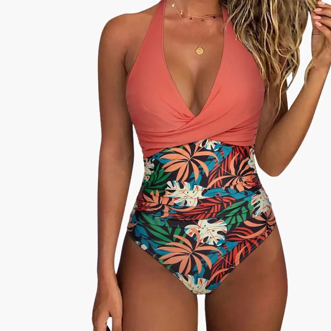 Women's V-neck one-piece swimsuit with coral wrap top and tropical-leaf print high-waisted bottom