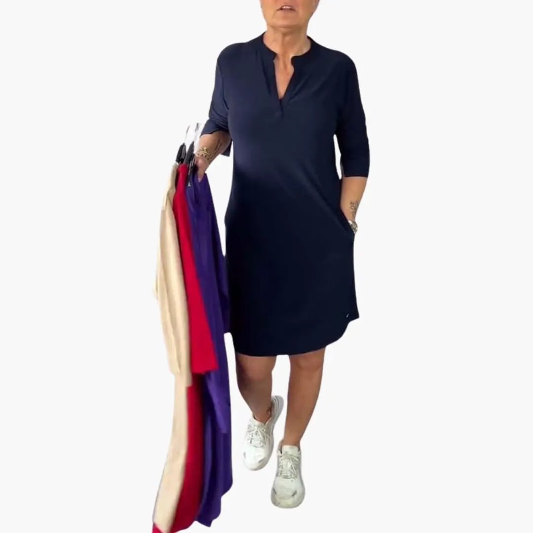 Women’s V-Neck Loose-Fit Midi Dress in navy on a model, paired with white sneakers.