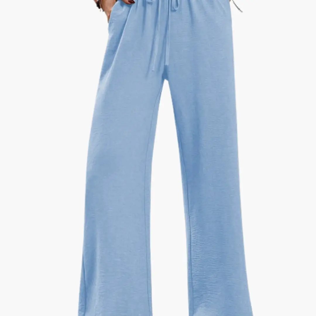 Women’s wide-leg pants with elastic waistband and side pockets in light blue by Wilfred Smith