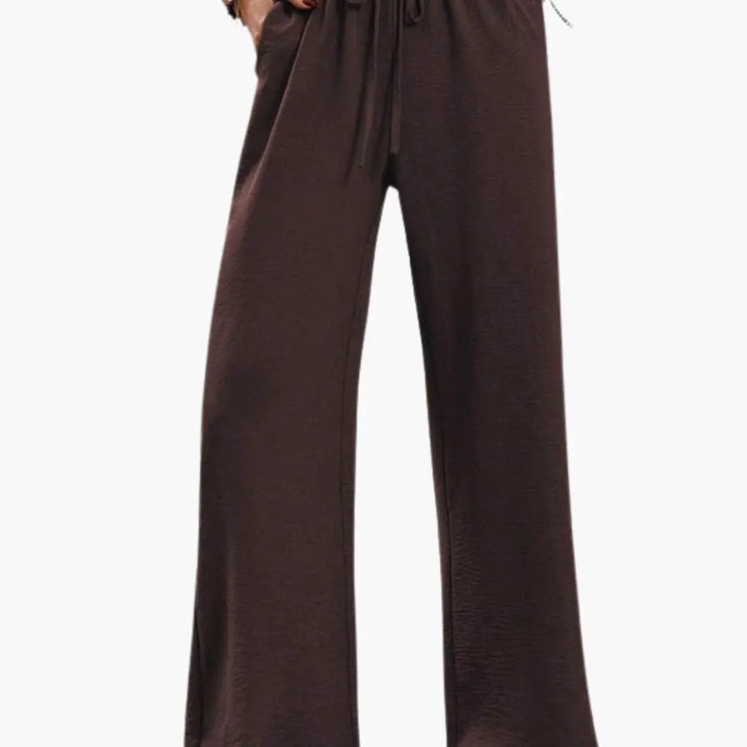 Women's wide-leg pants with elastic waistband in dark brown and side pockets.