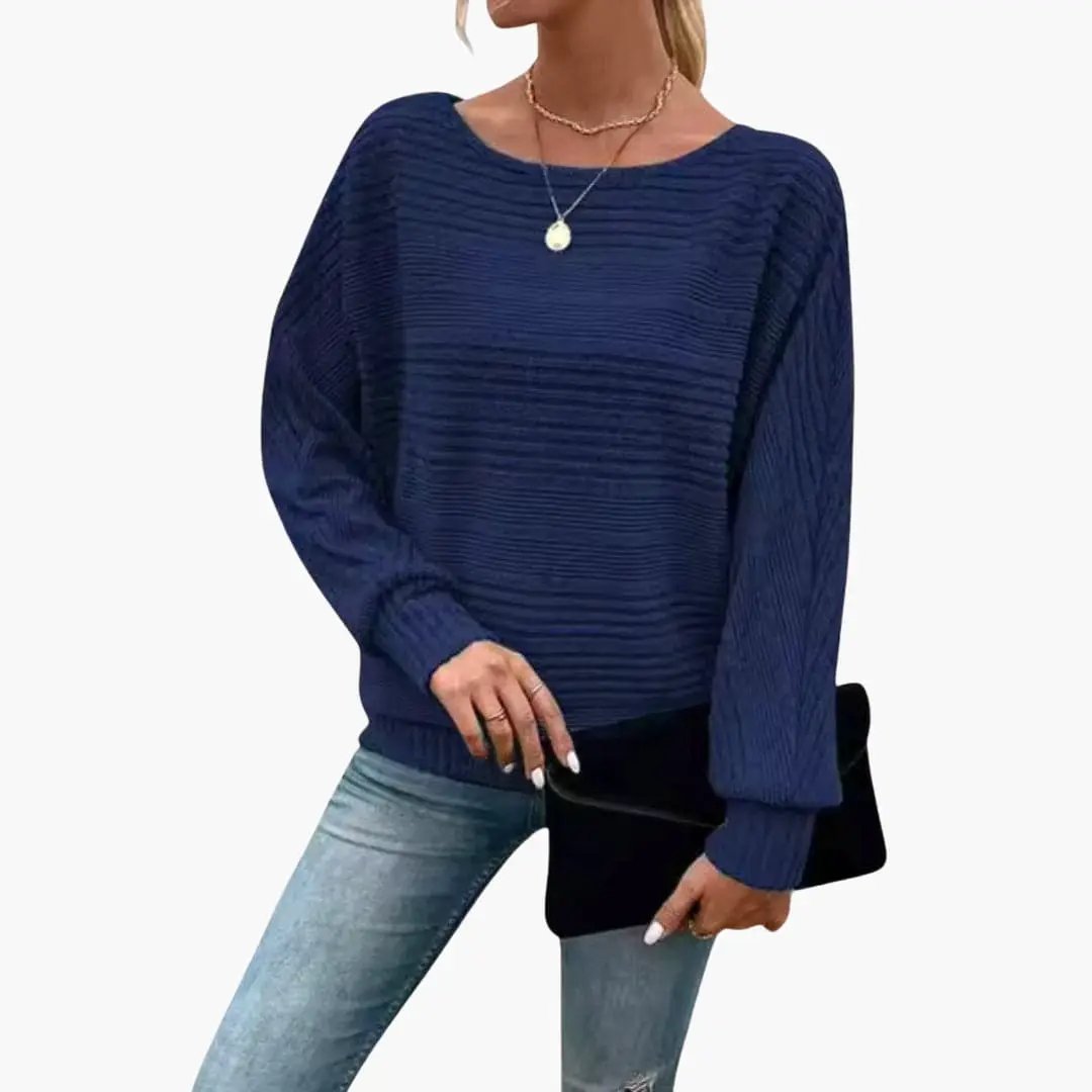 Women's striped navy knit sweater with boat neck and long sleeves