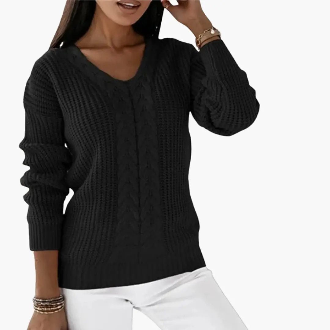Women's black pullover with V-neck and cable-knit front panel.