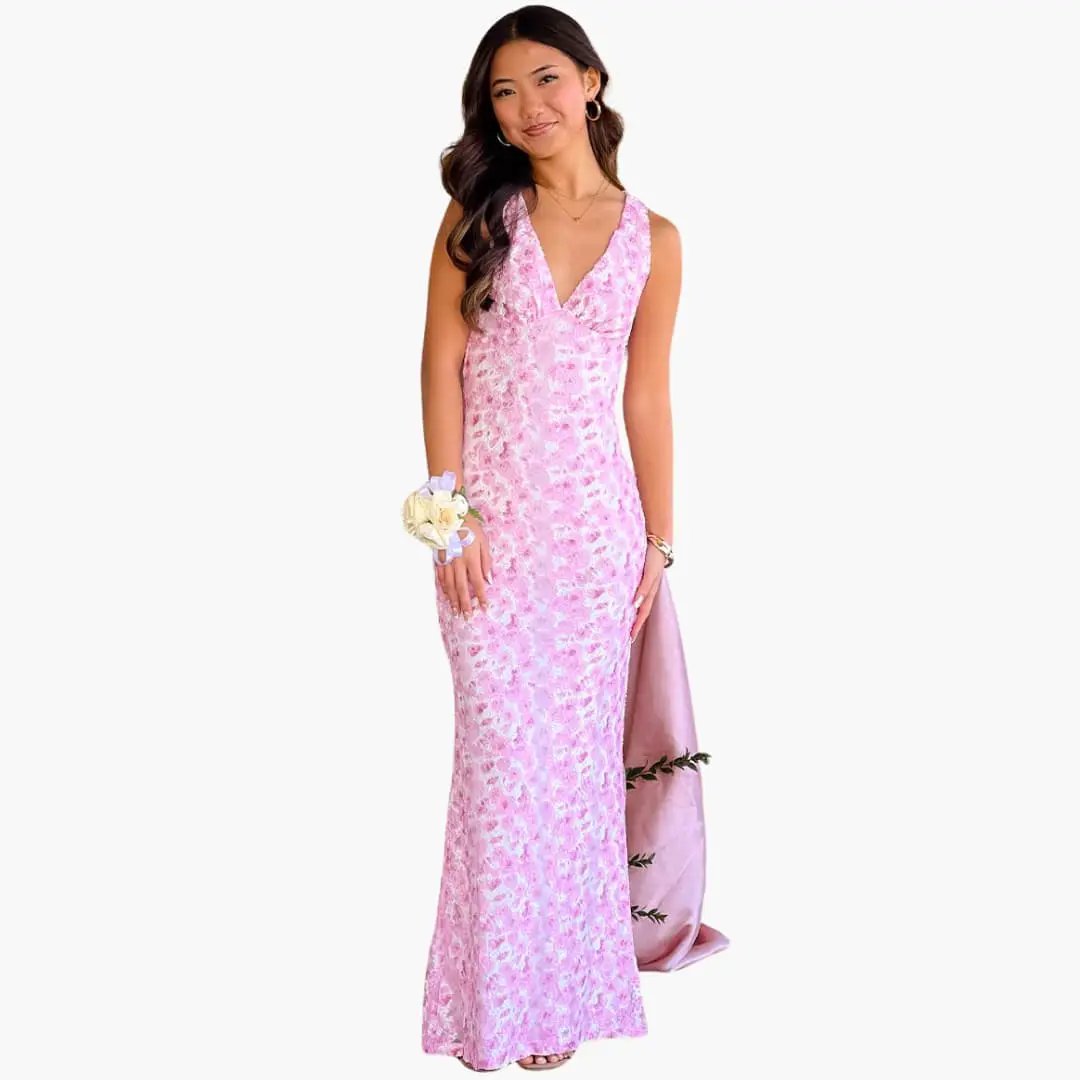 Pink lace maxi dress with V-neck on a model; elegant, floor-length gown