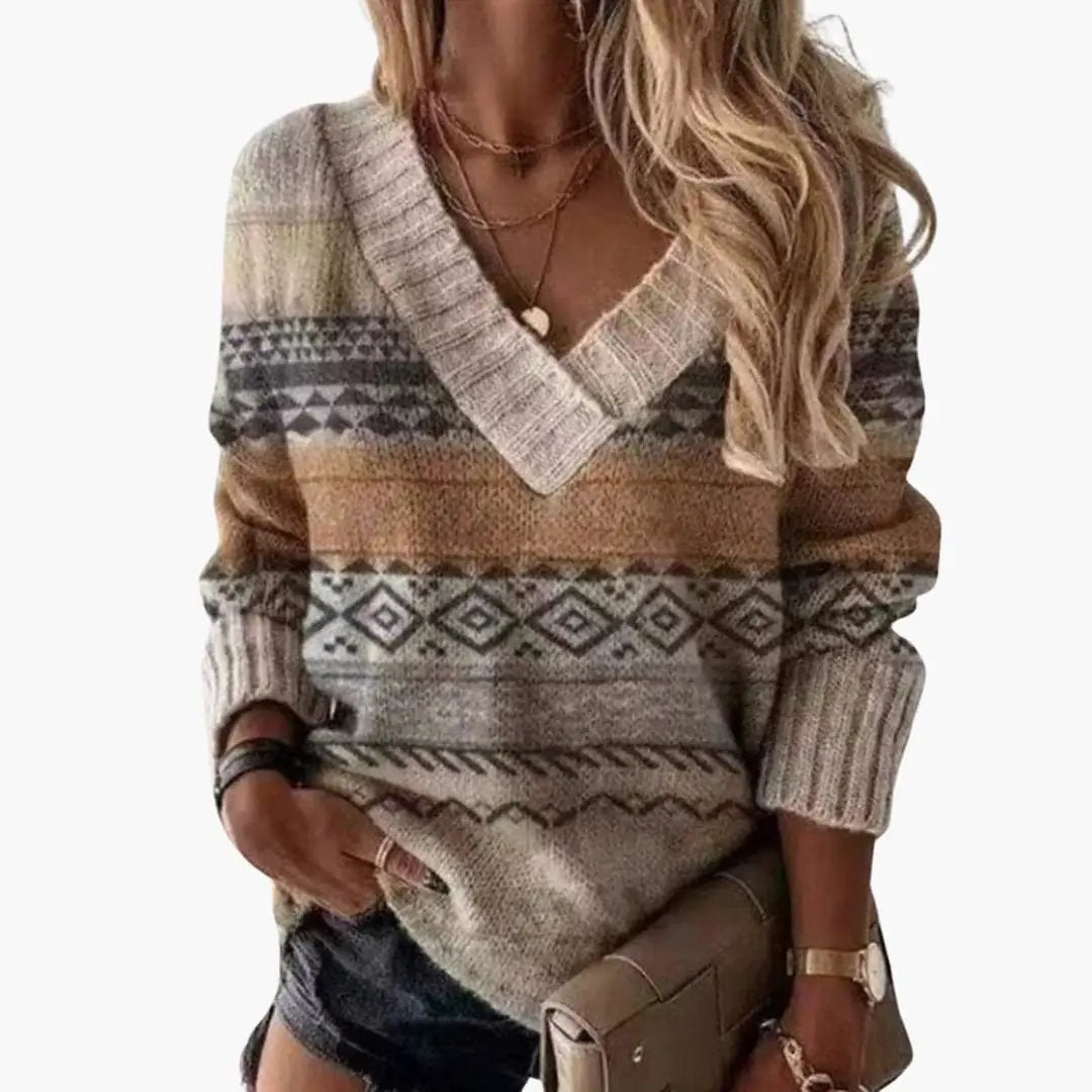 Women's V-neck animal-print knit sweater in beige, brown and gray tones with a chunky geometric pattern.