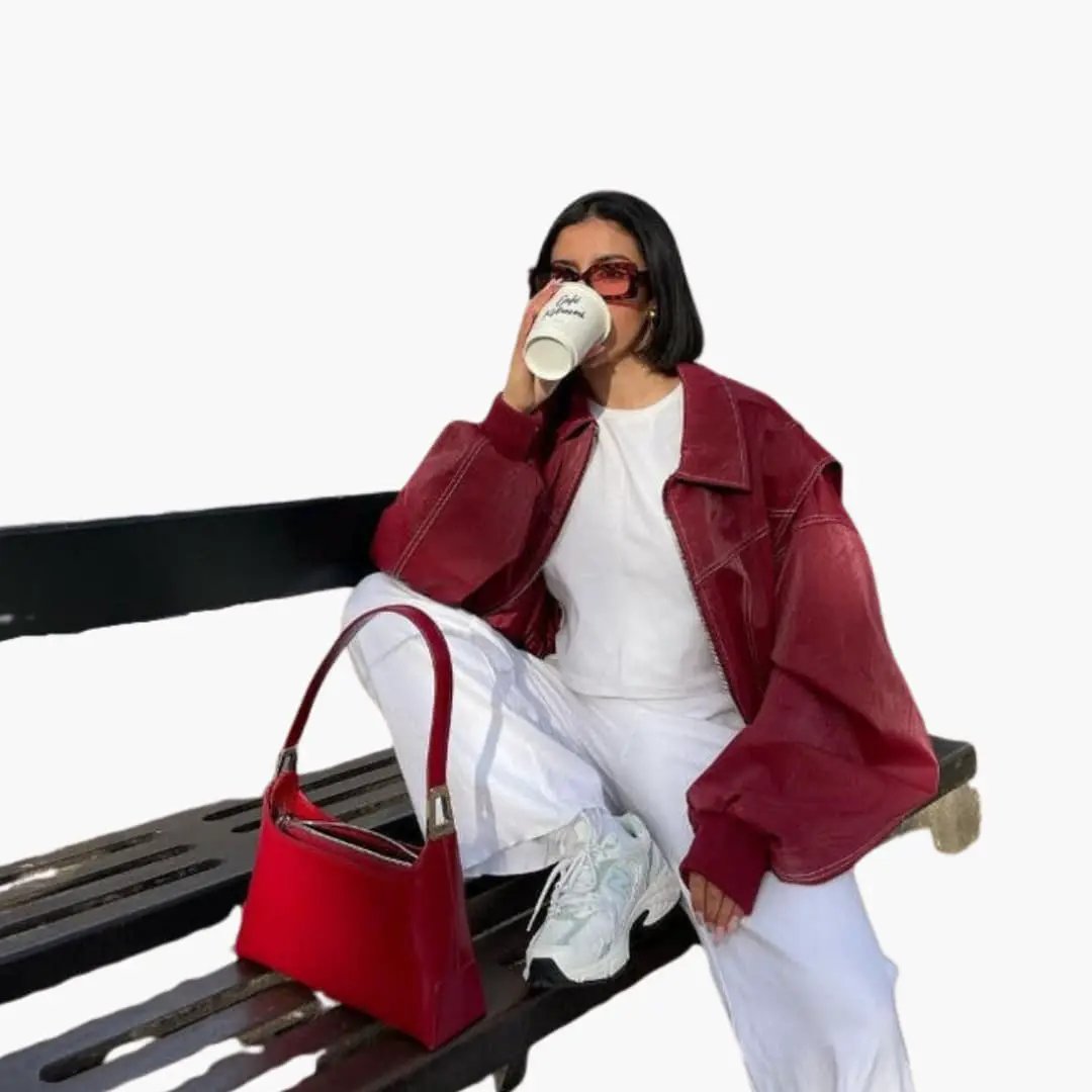 Women's oversized burgundy trucker jacket with long sleeves and contrast stitching by Wilfred Smith