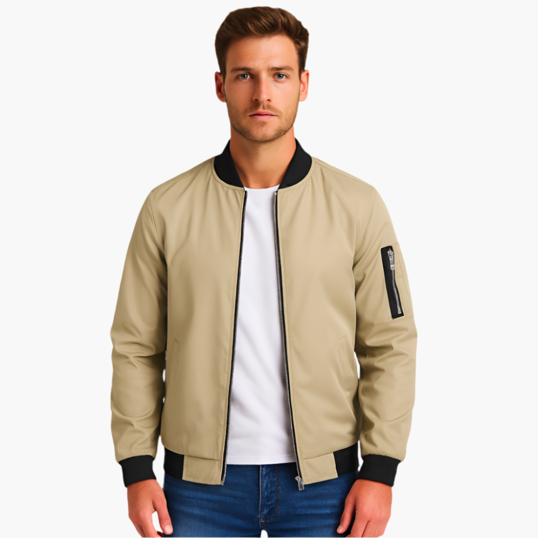 Men's beige bomber jacket with black ribbed cuffs and hem, zip front, and arm pocket