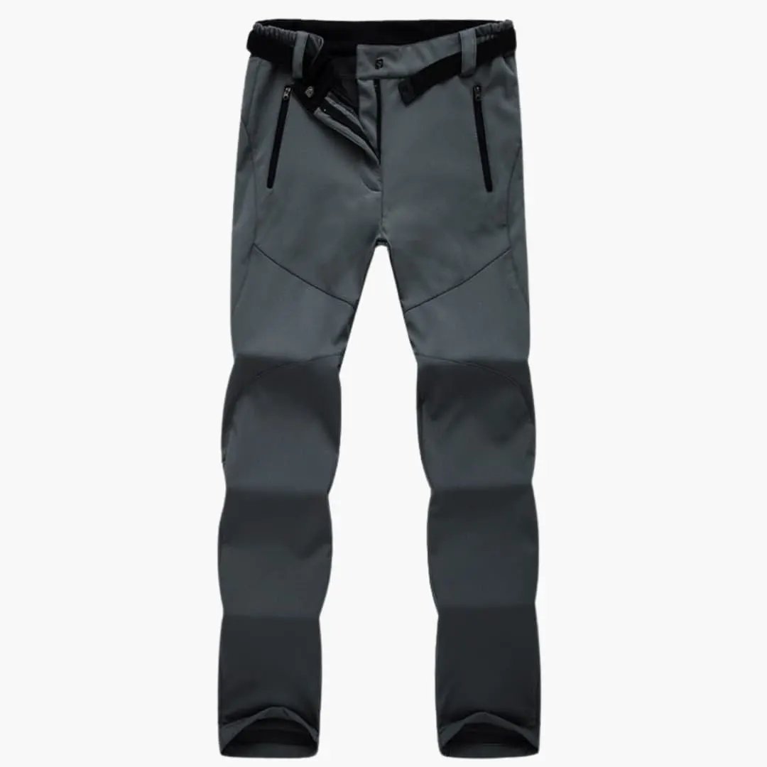Women's hiking pants with zip pockets in gray, featuring knee panels and an adjustable waist belt