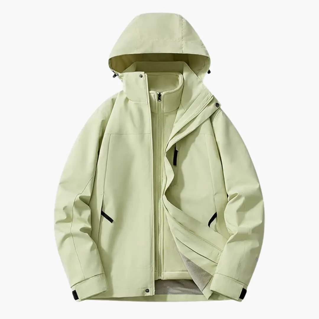 Unisex ski jacket with hood by Wilfred Smith in light green with zip pockets.