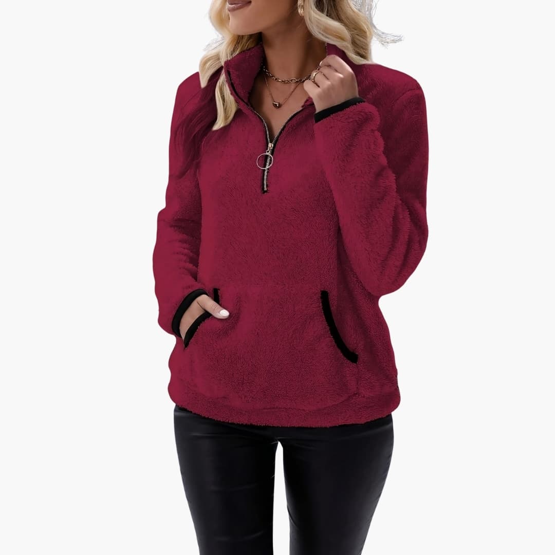Women's fleece pullover with half-zip in burgundy, plush texture, black-trim pockets, Wilfred Smith.