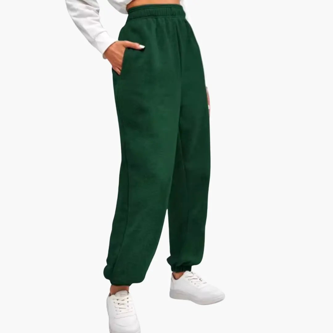 Women’s high waist jogger pants in dark green with pockets and elastic cuffs.