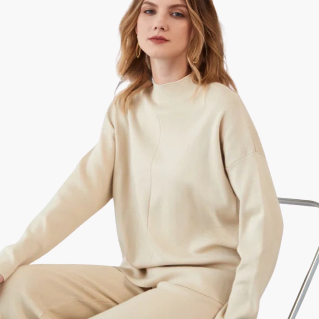 Women's loungewear set in beige sweater and wide-leg pants by Wilfred Smith.