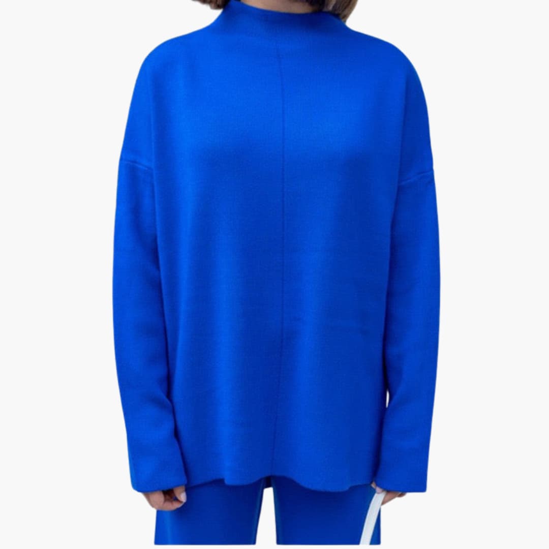 Women's loungewear set by Wilfred Smith in royal blue knit sweater and wide-leg pants.