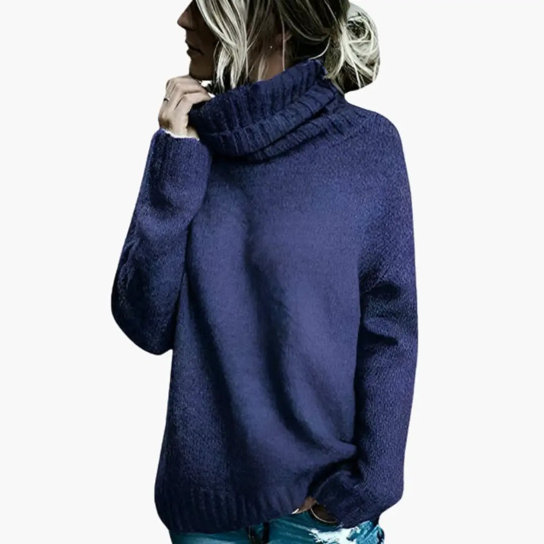 Women's oversized navy knit sweater with long sleeves and turtleneck.