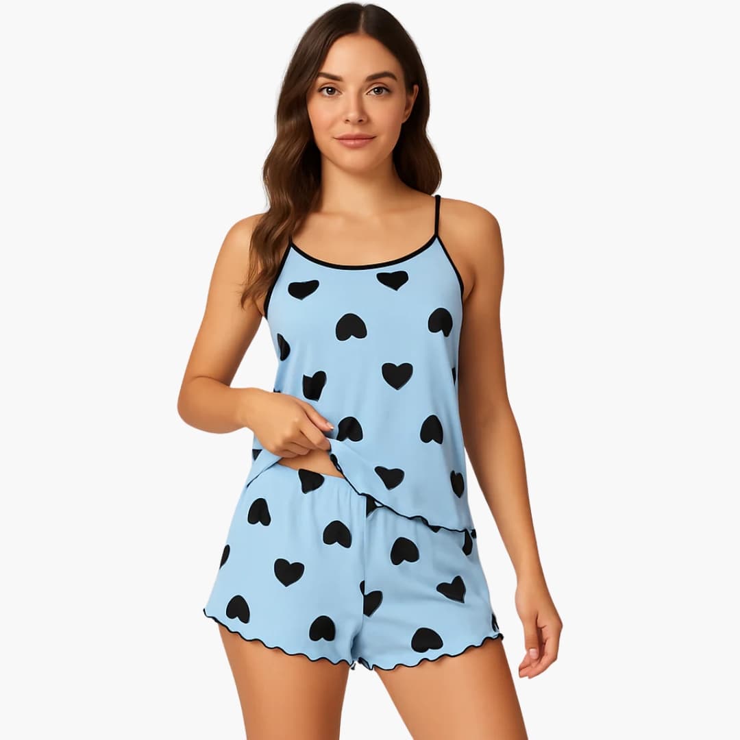 Women's two-piece pajama set in light blue with black heart print; short-sleeve top and shorts