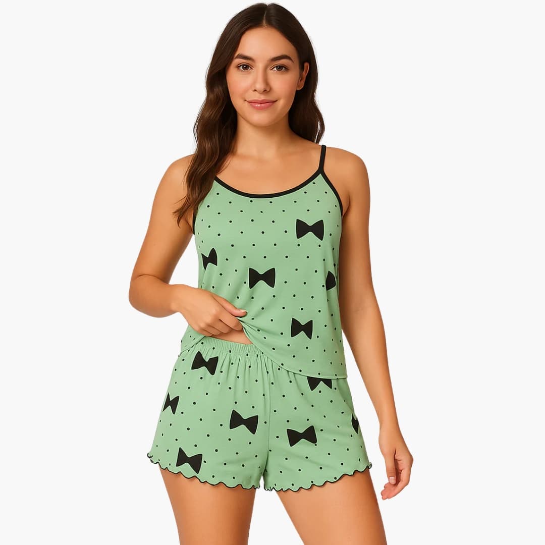 Women's two-piece pajama set with short sleeves and shorts, mint green with black bow print by Wilfred Smith.
