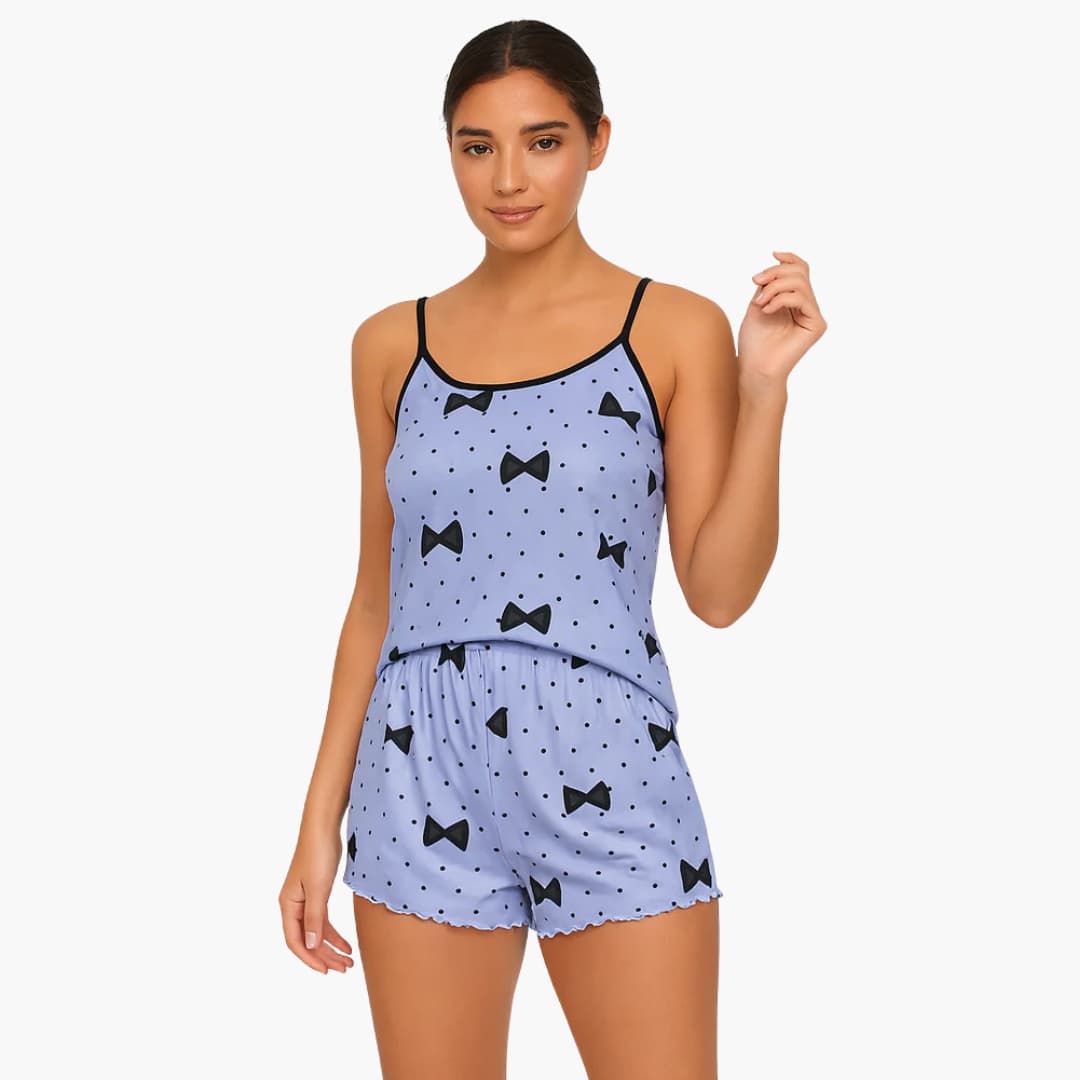 Women's pajama set with sleeveless tank-top and shorts, light blue with black bow print and polka dots.