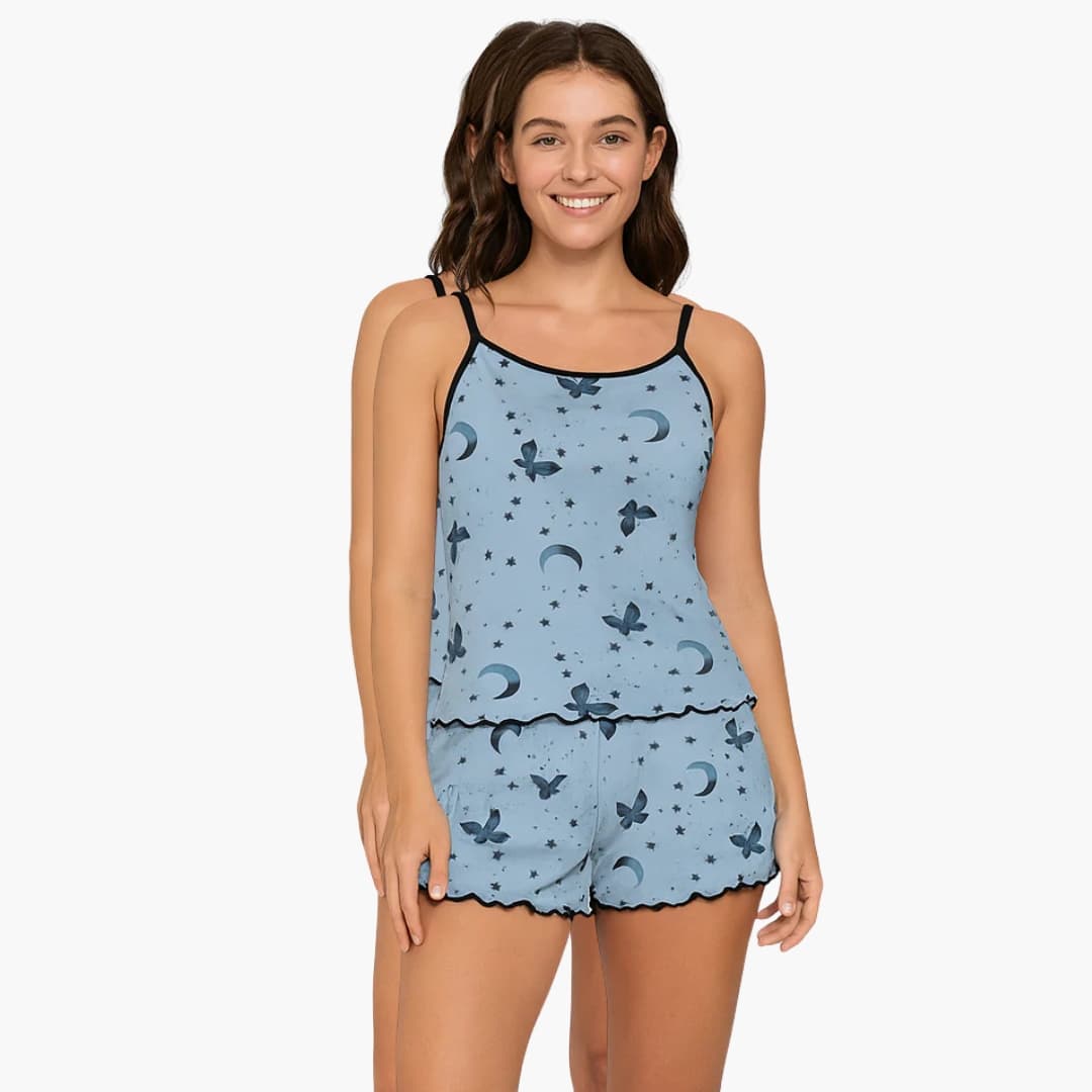 Women's pajama set by Wilfred Smith, light-blue two-piece with moon and butterfly print; short-sleeve top and shorts