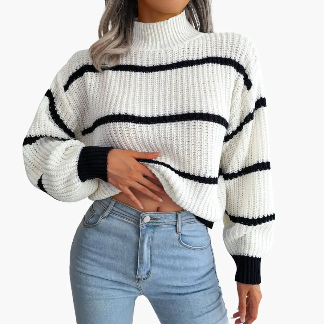 Women's knit sweater with black stripes and high collar; white chunky knit.