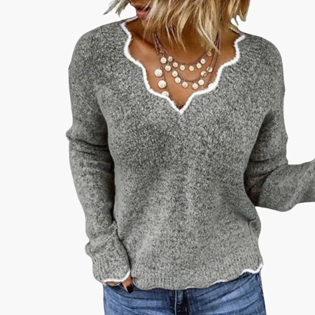 Women's knit gray heather sweater with white wavy-edge neckline, casual pullover