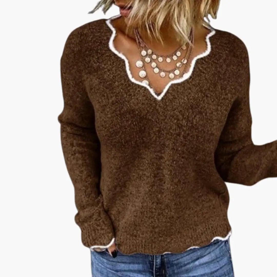 Women's brown textured knit pullover with white wavy neckline trim and long sleeves