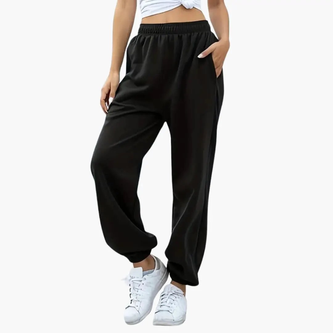 Women's sweatpants with side pockets, black baggy fit, elastic waistband, cuffed ankles