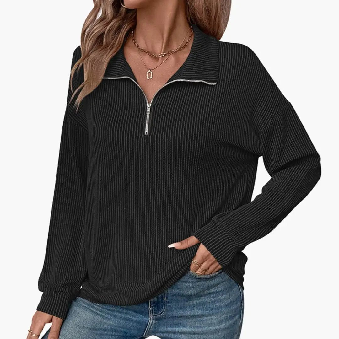 Women's striped pullover with silver half-zip collar in black knit, long sleeves.