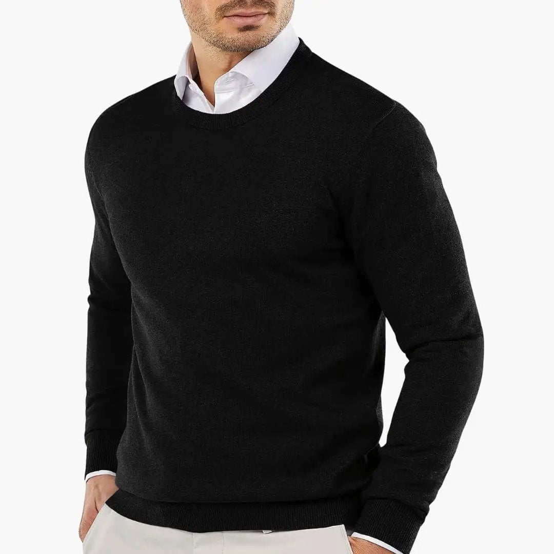 Men's black knitted long-sleeve sweater worn over a white shirt