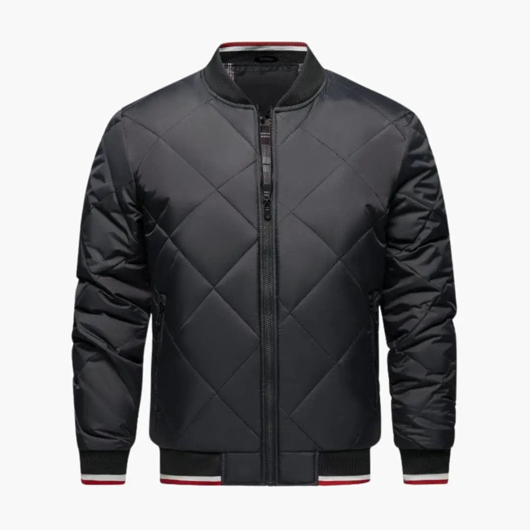 Men's bomber jacket with diamond quilted pattern, full zipper, charcoal black with ribbed cuffs and red-white trim.