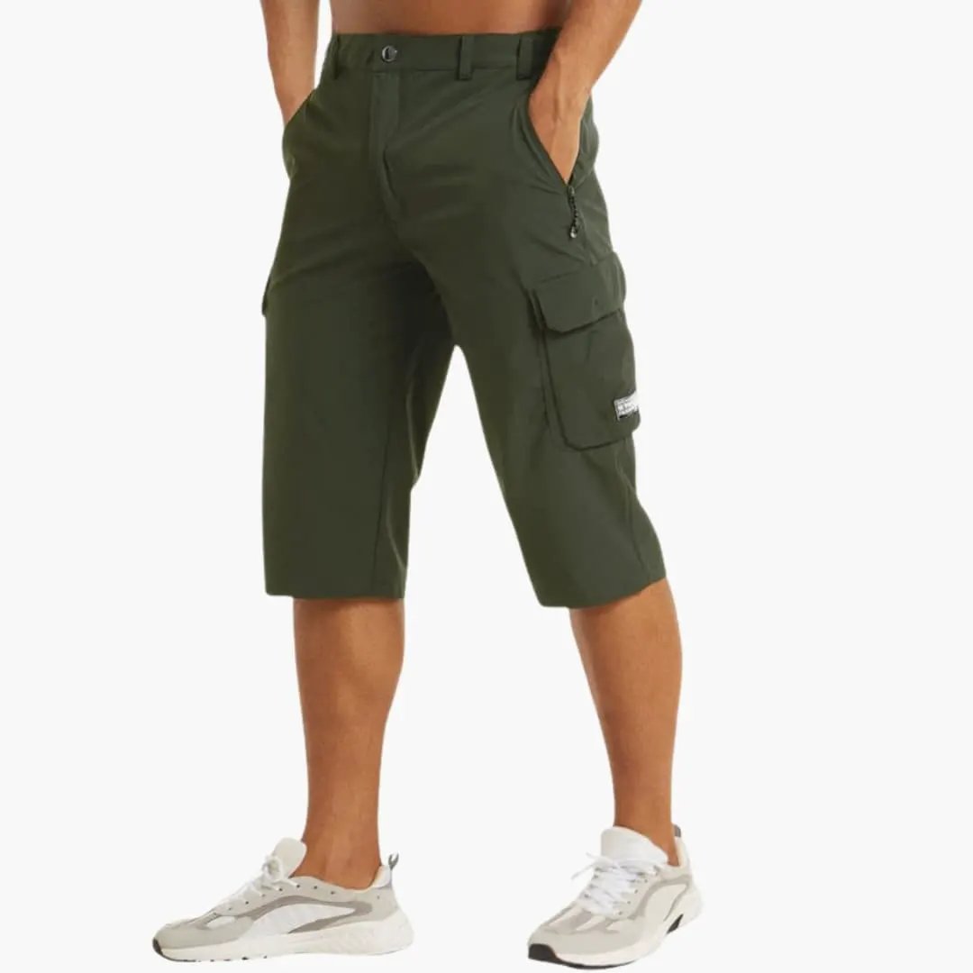 Men's cargo shorts in olive green with knee-length fit, stretch fabric, and zip pockets