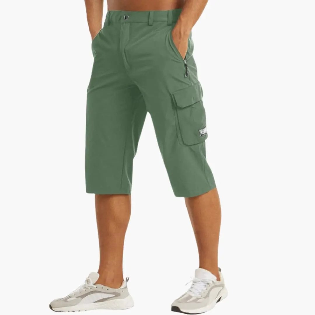 Men's cargo shorts by Wilfred Smith with stretch fabric, knee-length, green, zippered pockets.