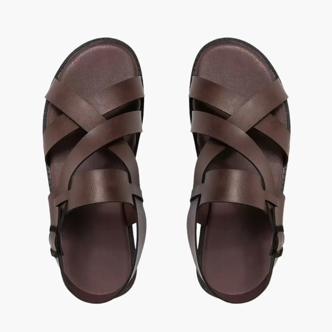 Pair of men's sandals with brown cross-strap uppers, adjustable strap and soft microfiber lining