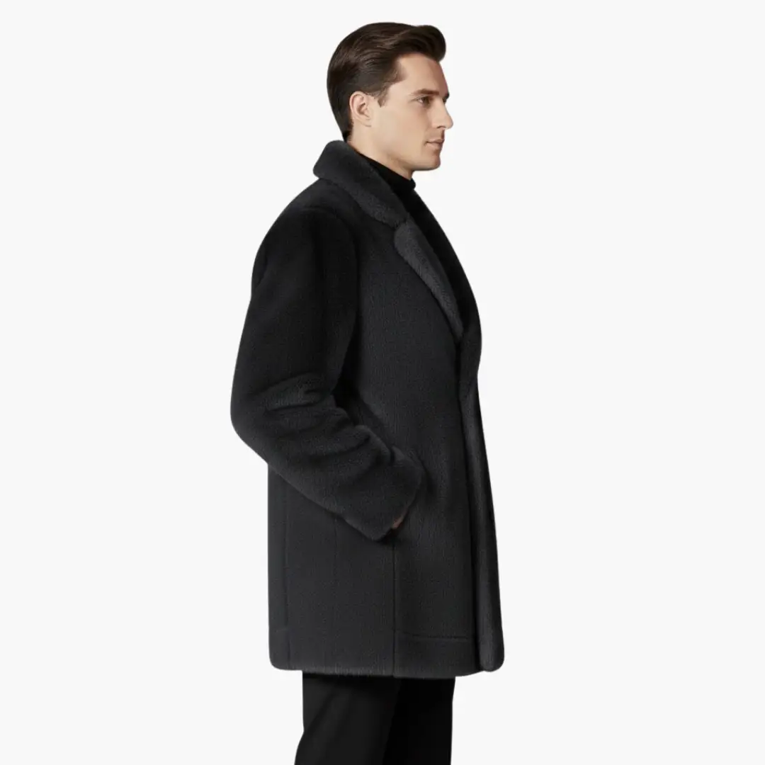Men’s faux fur coat in black with lapel collar and button front, shown in side profile.