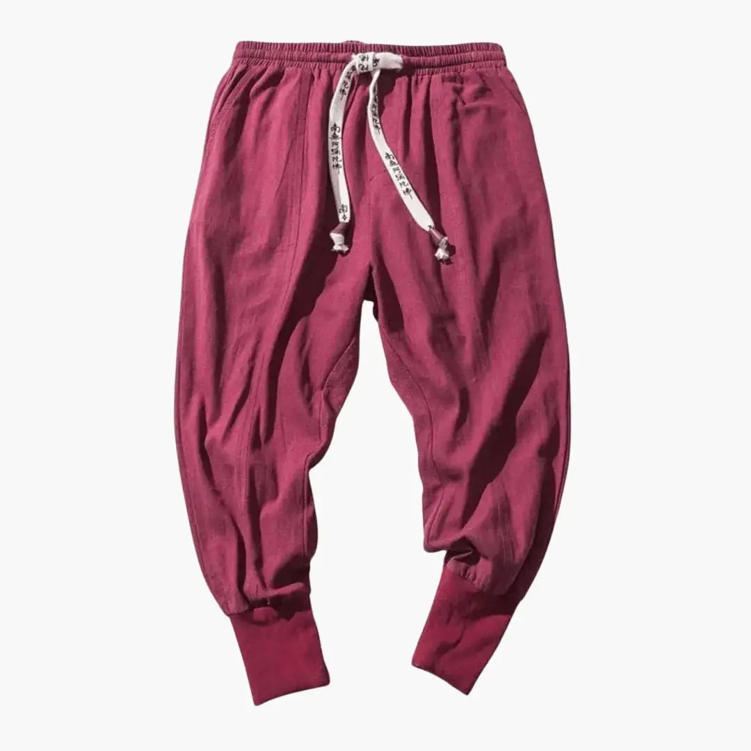 Men’s Japan-style burgundy cargo joggers with drop-crotch and adjustable drawstring waist.