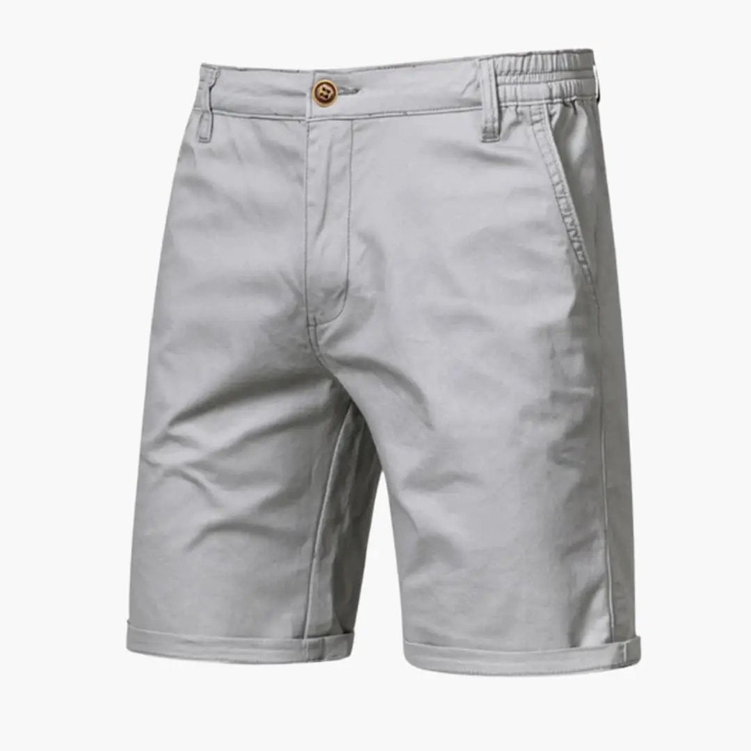 Men's knee-length chino shorts by Wilfred Smith with belt loops and zip closure, light gray