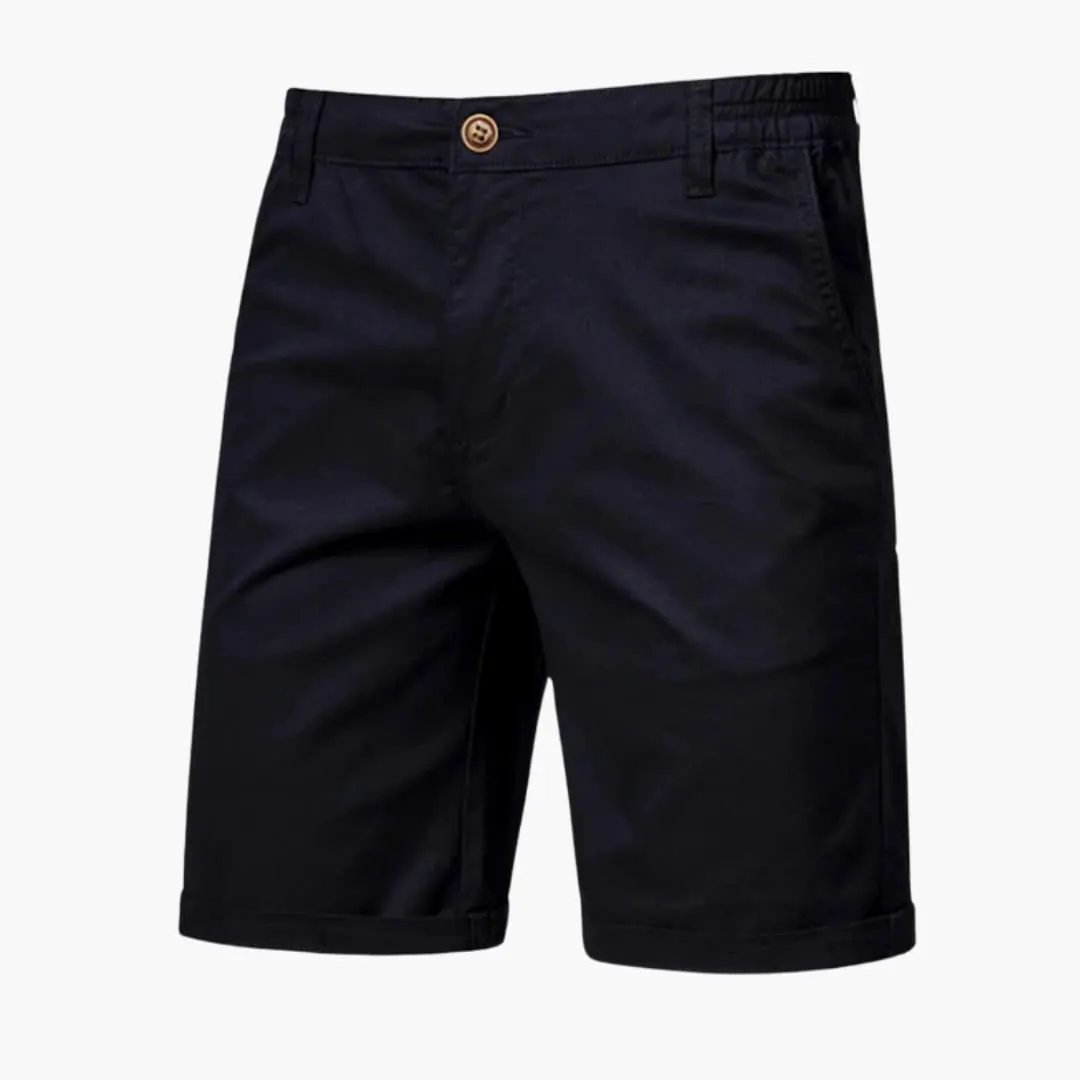Men's knee-length chino shorts by Wilfred Smith in navy with belt loops and zip closure