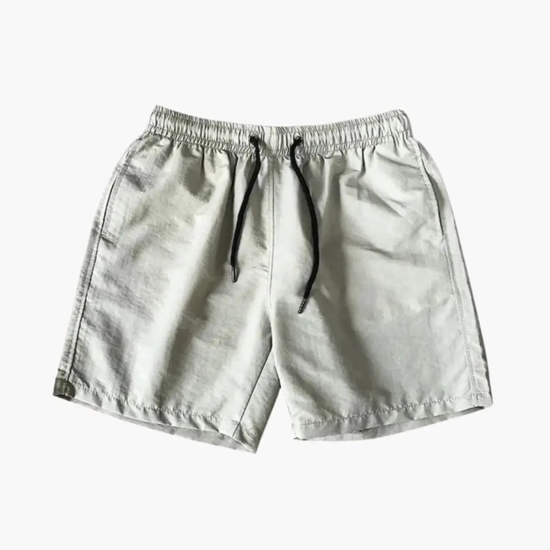 Men's knee-length jogger shorts with drawstring and zip pockets in light gray by Wilfred Smith