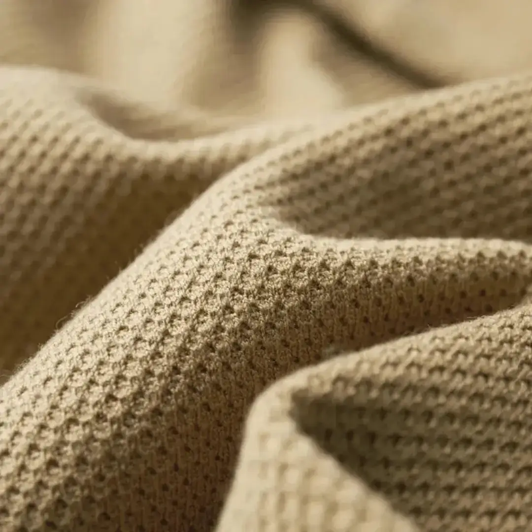 Men's open-front cardigan in beige with textured knit fabric.