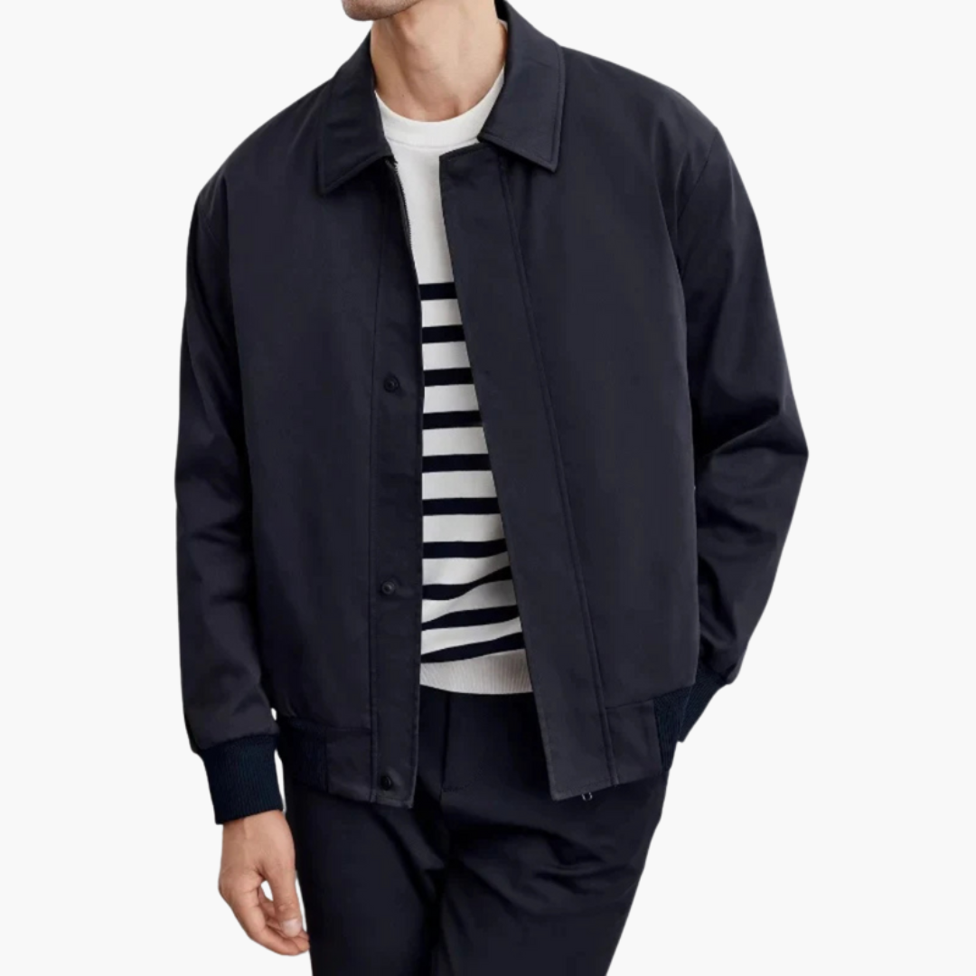 Men’s navy overcoat with pointed collar and button-front closure.