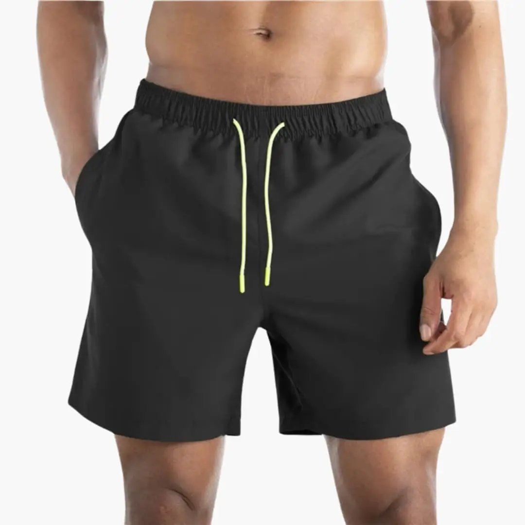Men’s jogger shorts in black with elastic waistband and neon yellow drawstrings