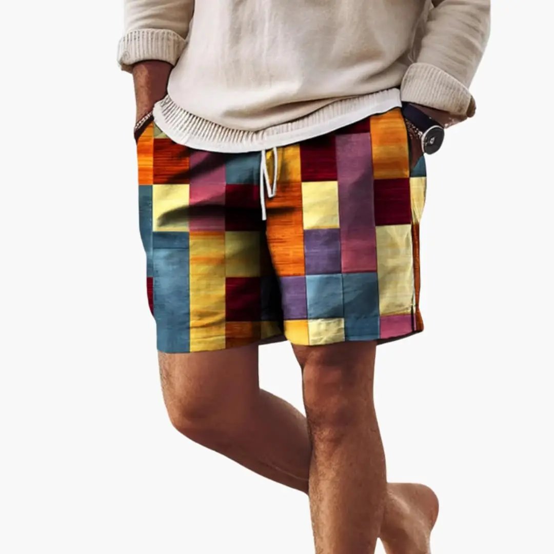 Men’s swim shorts with elastic waistband and multicolor block patchwork pattern, boardshorts