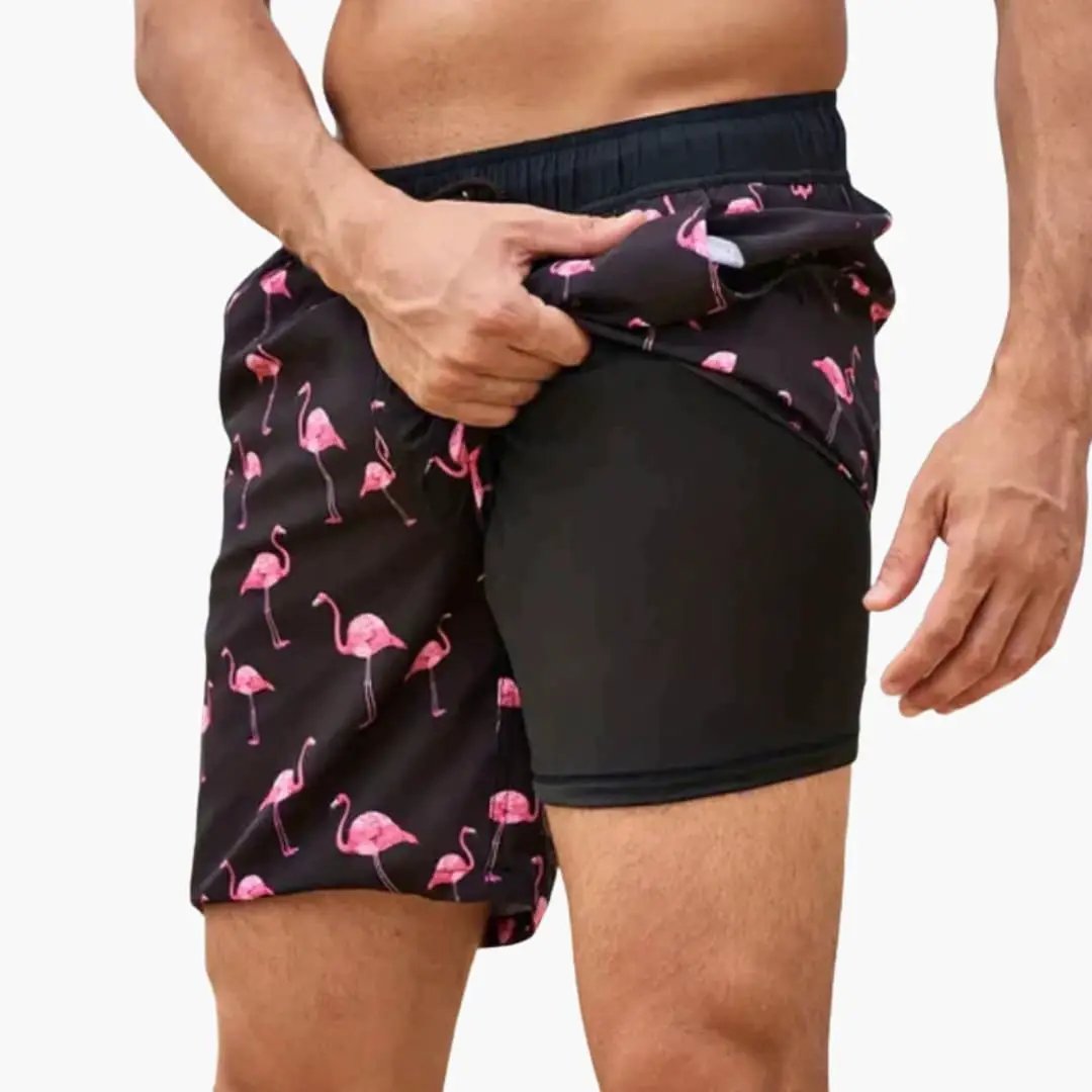 Men’s swim shorts by Wilfred Smith, flamingo-print boardshorts with drawstring waist and pockets